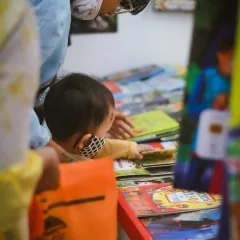 বইমেলায় বই দেখছেন দর্শনার্থীরা